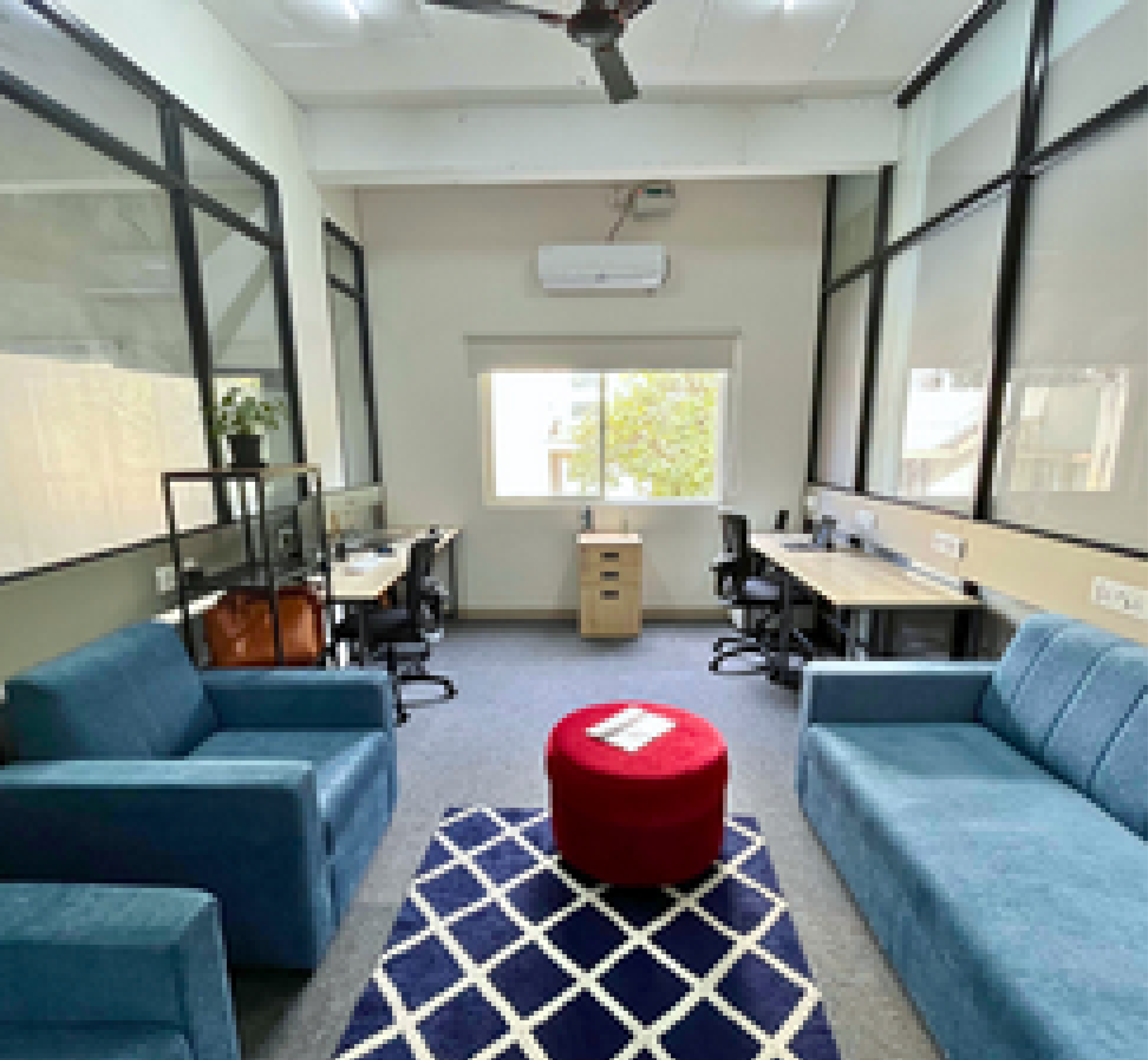 Workstation and sofa in office space